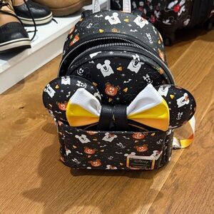 Loungefly Halloween Backpack in Black, White, Yellow, Orange